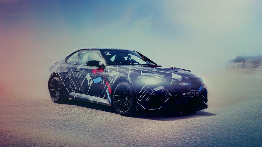 Sports car parked in a colorful desert landscape.