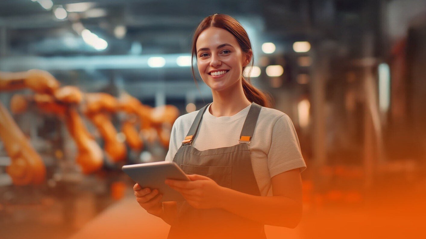 Woman with tablet in modern factory hall