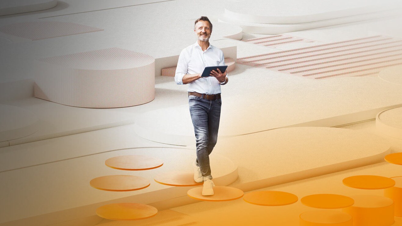 A person stands in a modern, abstract room and holds a tablet in their hands.